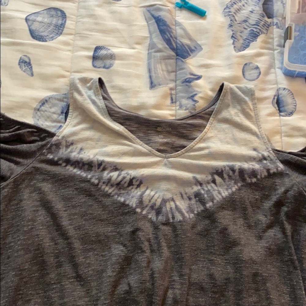 A tee with cut out shoulders